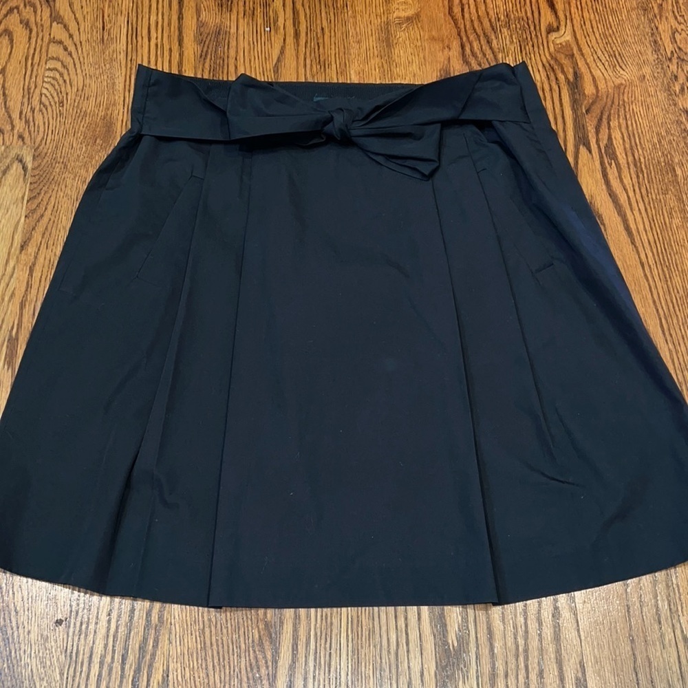 JCrew womens a-line pleated skirt with bow detail in front. Size 12 EUC.